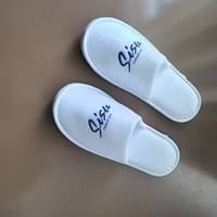 Chaussons jetables blancs confortables utilisés à la maison, au spa, à l'hôpital, à l'hôtel, avec logo