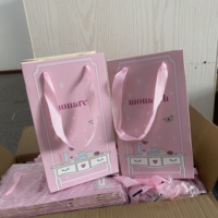 Sacs cadeaux personnalisés de haute qualité en papier avec votre propre logo pour l'emballage d'accessoires de mode