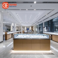 Vitrine d'îlot commerciale en métal pour bijoux, présentoir de comptoir doré pour bijouterie
