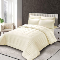 Nouveau design ensembles de literie en coton dans un sac doux et chaud avec ensemble de couette et ensemble de draps solides taie d'oreiller mode matelassée