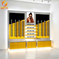 Vitrine murale de luxe moderne et écologique pour lunettes de soleil, présentoir mural personnalisé jaune pour magasins d'optique et centres commerciaux