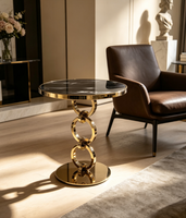 Table d'appoint de luxe italienne à anneaux, plateau en marbre noir et or, table d'appoint artistique pour salon de villa