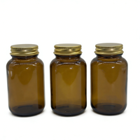 Bouteille en verre ambré avec bouchon à vis en aluminium et couvercles métalliques pour comprimés et capsules, avec scellage par induction thermique – Approvisionnement direct usine