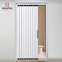 Porte-fenêtre pliante moderne en alliage d'aluminium, invisible, pour cuisine ouverte, cloison simple à lamelles, surface finie en PVC, pour cour
