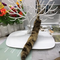 Vente en gros de porte-clés en fourrure de renard de civette véritable, design élégant, vente en gros de fourrure de renard de civette naturelle du sud