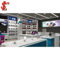 Moderno Exhibidor de Teléfonos Móviles Blanco y Azul con Tira de LED y Mesa de Experiencia para Laptops, Ideal para Tiendas Samsung Galaxy