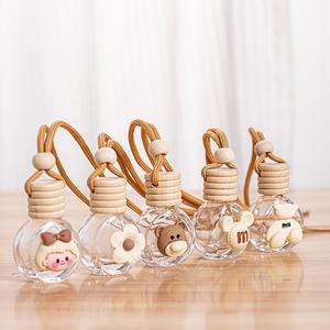 Bouteille de parfum pour voiture suspendue, mini désodorisant pour voiture de 10 ml, bouteille de parfum en verre sphérique transparente avec corde et bouchon en bois - Product Image 1