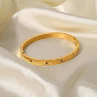 Vente en gros de bracelets design en acier inoxydable avec œil en zircone colorée en plaqué or pour cadeau