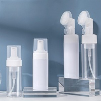 Bouteilles à pompe en mousse de plastique PET personnalisées 100ml 200ml avec tête de brosse en silicone pour cosmétiques, maquillage, nettoyant visage, savon