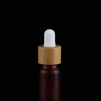 Botol Tetes Kaca Merah Buram dengan Logo Kustom Profesional dan Tutup Bambu untuk Penyimpanan Minyak Esensial Kosmetik Merek Kecantikan.