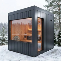 Sauna extérieur moderne en forme de cube, préfabriqué en bois massif, avec grande fenêtre panoramique en verre pour villa, jardin ou spa.