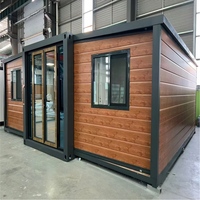 Maison conteneur de luxe extensible et démontable avec revêtement en bois pour villa de jardin ou complexe hôtelier
