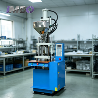 Machine de moulage par injection verticale robuste 35T pour la fabrication de fiches de câbles d'alimentation, adaptateurs CC, connecteurs et moules d'injection PVC