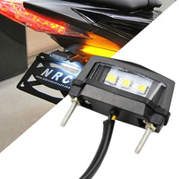 Vente chaude : éclairage de plaque d'immatriculation LED pour moto, lumière arrière universelle modifiée, lumière décorative d'avertissement, Guangdong