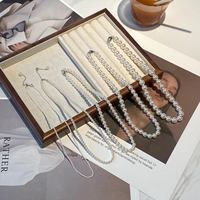Francés exquisito nicho temperamento multicapa bobinado perla clavícula cadena señora chica joyería de moda collares