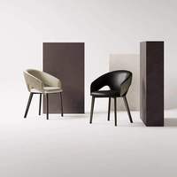 Fauteuil de salle à manger en cuir au design délicat, style italien, avec dossier incurvé élégant et structure en fer massif.