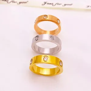 Logo carved classic gold plated stainless steel ring jewelry luxury designer diamond eternity ring for women