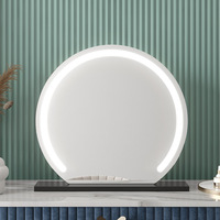 Miroir de maquillage de vanité de bureau à LED rond moderne avec un design demi-circulaire pour une utilisation en chambre