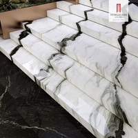 Carreaux de porcelaine en marbre blanc Panda 1200x2700mm à texture continue pour murs intérieurs modernes et comptoirs de salle de bain