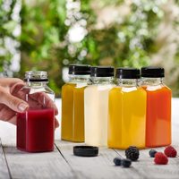 Bouteilles de jus, de thé et de boissons jetables personnalisées transparentes, bouchon à vis en plastique avec étiquette, fabrication