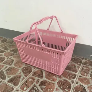 सुपरमार्केट गुलाबी प्लास्टिक की टोकरी सुविधा हाथ दुकान खरीदारी की टोकरी