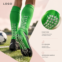 Chaussettes de football renforcées pour équipes de jeunes, vert vif, à profil fin, pour une adhérence sécurisée sur terrain, avec base de crampons et conception graduée pour la taille