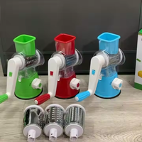 Hete Aanbieding Multifunctionele Keukenhulp, Voedselveilige Handmatige Fruit- en Groentesnijder, Kleurrijke Trommelhakselaar, Verpakt in Karton