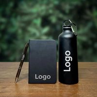 Ensemble promotionnel moderne noir : Bouteille d'eau, carnet et stylo pour événements technologiques, cadeaux marketing, lot en gros