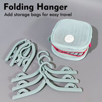 Cintres à vêtements pliables en plastique modernes personnalisés Trustloops OEM, cintres portables pour voyages, cintres pour la décoration de la maison