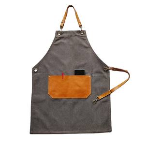 Tablier <span class=keywords><strong>de</strong></span> cuisine en toile épaisse avec poche en cuir tablier <span class=keywords><strong>de</strong></span> menuiserie décorateur <span class=keywords><strong>peintre</strong></span> <span class=keywords><strong>tenue</strong></span> <span class=keywords><strong>de</strong></span> travail peut être logo personnalisé - Product Image 1