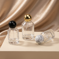 Flacon de parfum en verre de 100 ml en gros avec 15 vaporisateurs à baïonnette, fond épais, cylindre en résine pour bouchon à bille, logo personnalisé, sérigraphie