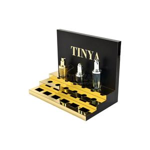 Support de soin de la peau de bureau en acrylique au design personnalisé Tinya, support de crème pour les <span class=keywords><strong>yeux</strong></span> de luxe, noir et or, marque haut de gamme, présentoir de magasin de beauté - Product Image 2
