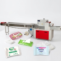 Machine d'emballage flow-pack pour serviettes hygiéniques, masques faciaux, couches, lingettes humides pour bébés, lingettes en tissu et lingettes humides en forme de coussin