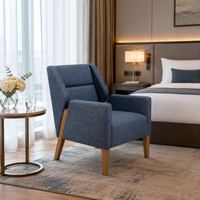 Fauteuil rembourré bleu pour l'hôtellerie, idéal pour les chambres d'hôtel, les suites, les halls d'accueil et les achats en gros
