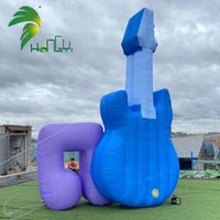 Ballon publicitaire gonflable personnalisé Hongyi 2026 en bâche PVC, modèle guitare musicale avec logo LED