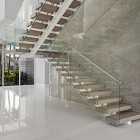 Escalier flottant en acier et bois avec garde-corps en verre pour escalier intérieur moderne invisible à monopoutre