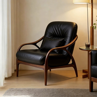 Fauteuil élégant et moderne en velours noir/cuir avec structure en bois distinctive – Idéal pour la détente dans un appartement ou une chambre – Léger et durable