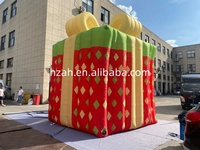 Boîte cadeau gonflable géante en forme de maison de Noël pour la publicité extérieure de Noël