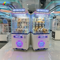 Machine de jeu d'amusement à pièces colorée Fun Indoor Entertainment Peluche Griffe de grue Métal d'un an pour centres de jeux