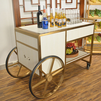 Ventes directes d'usine de chariot de bar à liqueur d'hôtel haut de gamme en acier inoxydable en métal personnalisé chariot de service de restauration