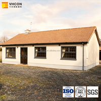 Bungalow familial à un étage, trois chambres, cuisine ouverte, véranda couverte, livraison clé en main, ville rurale, structure en acier, villa