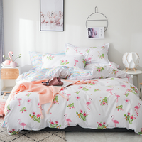 Parure de lit 4 pièces en coton imprimé, douce et agréable pour la peau, comprenant une housse de couette, un drap plat et des taies d'oreiller pour la chambre à coucher.