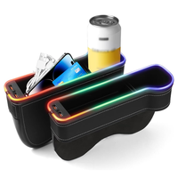 Boîte de rangement multifonctionnelle pour l'espace entre les sièges de voiture, avec lumière LED