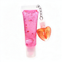 Best-seller transfrontalier : Brillant à lèvres effet miroir changeant de couleur, hydratant et repulpant, avec ornement suspendu en forme de coquille et de cœur