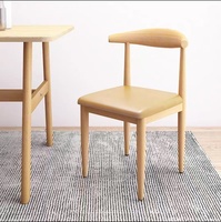 Chaise de salle à manger de style nordique et médiéval avec revêtement en cuir et coussin moelleux, modèle Horn Chair pour meubles de maison, pieds en métal