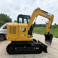 En stock : Pelle hydraulique CAT 308E2 avec chenilles en acier et accessoires personnalisés disponibles pour les travaux municipaux, agricoles et de construction.