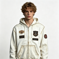 Sweat à capuche zippé effet vieilli, style streetwear épais, avec patchs et bords déchirés, blanc, pour homme, vente en gros par lot