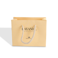 Bolsas de papel de embalaje de lujo, bolsa de papel de arte impresa personalizada, asas retorcidas, bolsa de papel de compras de lujo