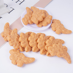Modelo simulado de nugget de pollo con forma de dinosaurio, bolsa divertida, llavero, colgante, juguete de PVC simulando nugget de pollo frito. - Product Image 1