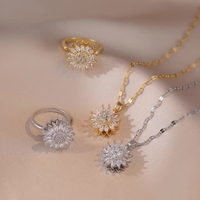 Parure de bijoux tournesol en acier inoxydable X202 plaqué or, avec bague rotative, collier pendentif en cuivre, bracelet et boucles d'oreilles pour femme